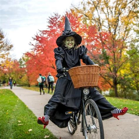 Wicked witch of the webs riding bicycle
